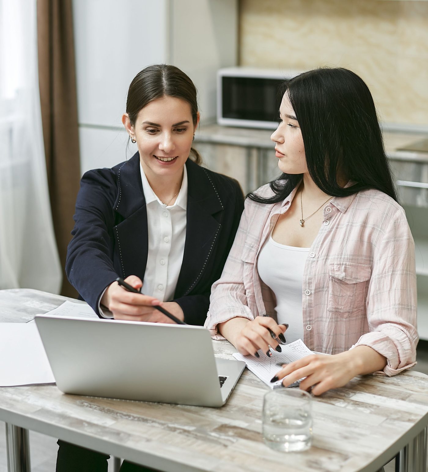 An Ashford advisor going through program details with a student